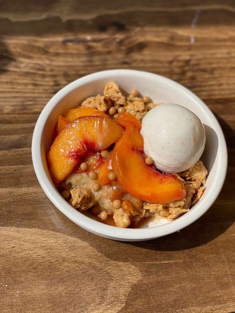 Dessert featuring Bennett Peaches and vanilla ice cream. 